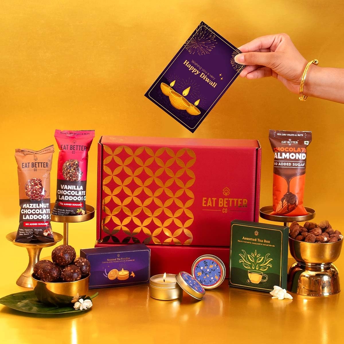 Tyohaar 7-Item Diwali Festive Hamper – Chocolate Coated Nuts, Dry Fruit Laddoos and Tin Candles | Corporate & Family Gifting Tyohaar 7-Item Diwali Festive Hamper – Chocolate Coated Nuts, Dry Fruit Laddoos and Tin Candles | Corporate & Family Gifting