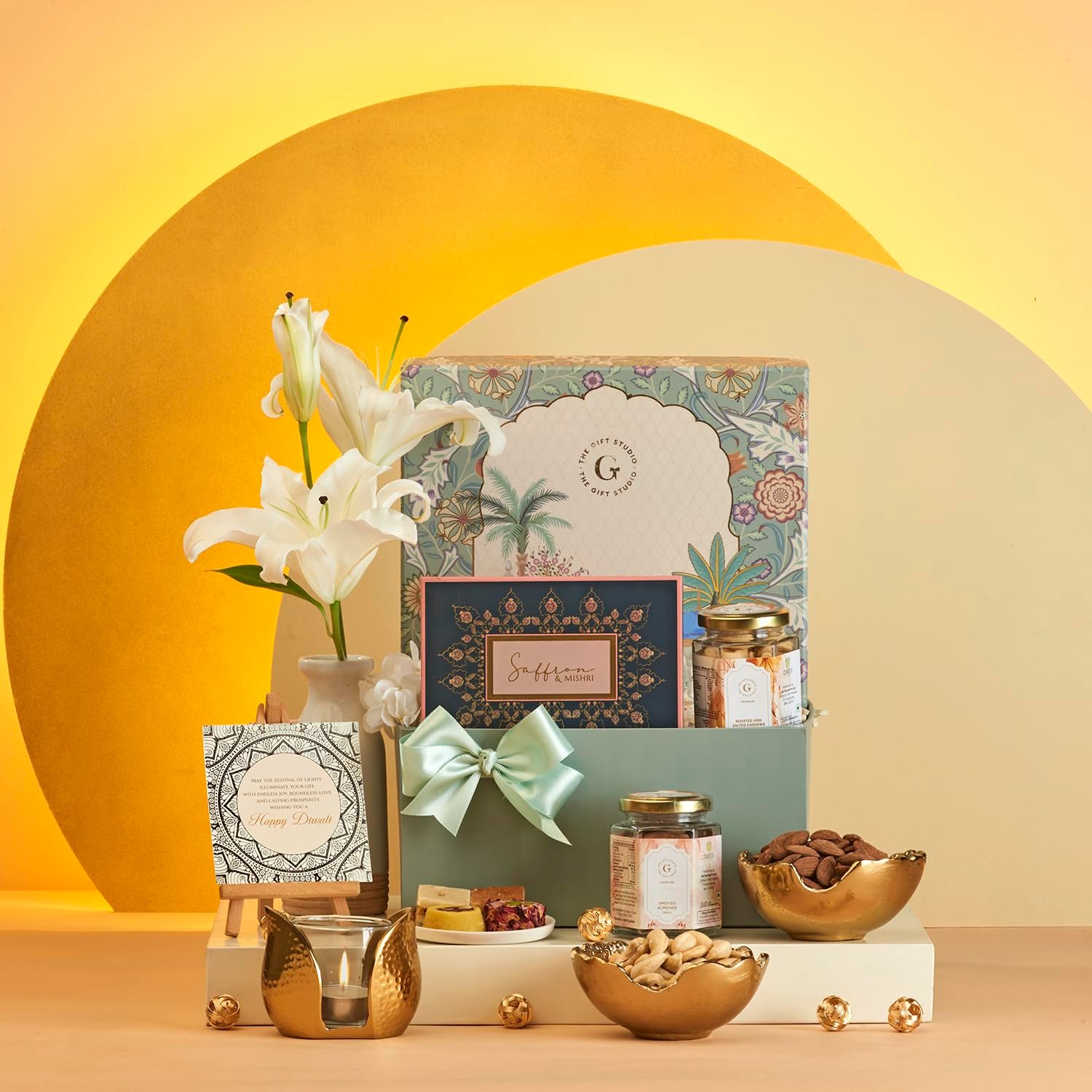 THE GIFT STUDIO.COM Diwali Gift Box Mindful Celebration | Festive Mughal Garden Box with Roasted Cashews, Smoked Almonds, Luxe Chocolates, Bowls Set & Tulip T-Light Holder | Premium Festive Hamper THE GIFT STUDIO.COM Diwali Gift Box Mindful Celebration | Festive Mughal Garden Box with Roasted Cashews, Smoked Almonds, Luxe Chocolates, Bowls Set & Tulip T-Light Holder | Premium Festive Hamper