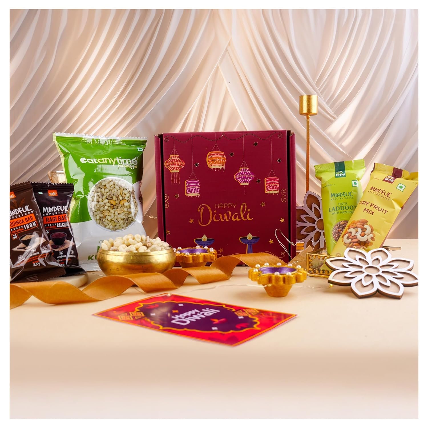 81mdcexid5l. sl1500 Eat Anytime Diwali Dhamaka Hamper | 11 Items Diwali Gift Box with Dry Fruits, Chocolates, Date Laddoos, Roasted Namkeen, Beautiful Diyas, Rangoli, Lights & more | Perfect Family & Corporate Gifting